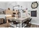 Modern kitchen featuring stainless steel appliances, ample counter space, a breakfast bar, and pendant lighting at 533 Boundary Blvd, Rotonda West, FL 33947
