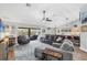 Bright and airy living room with comfortable seating, hardwood floors, and seamless access to outdoor living spaces at 533 Boundary Blvd, Rotonda West, FL 33947