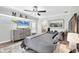 Spacious main bedroom with beach-themed decor, large TV and lots of natural light at 533 Boundary Blvd, Rotonda West, FL 33947