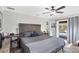 Spacious main bedroom with patio access and view of the backyard pool at 533 Boundary Blvd, Rotonda West, FL 33947