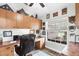 Functional home office with built-in cabinets, desk, and natural light from a window at 533 Boundary Blvd, Rotonda West, FL 33947