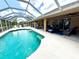 Sparkling screened pool with ample lounge space, perfect for enjoying sunny days at 533 Boundary Blvd, Rotonda West, FL 33947