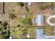 Bird's eye view of the property showing the layout of the home and its surrounding landscape and outbuildings at 551 Morrison Ave, Englewood, FL 34223