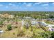 The property's location within a serene neighborhood setting, surrounded by lush greenery and community amenities at 551 Morrison Ave, Englewood, FL 34223