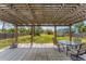 Backyard featuring a deck with pergola offering an ideal space for outdoor living and dining at 551 Morrison Ave, Englewood, FL 34223