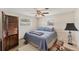 Cozy bedroom with a ceiling fan and two windows providing natural light at 551 Morrison Ave, Englewood, FL 34223