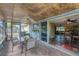 Enclosed lanai offering an inviting space for dining and relaxation with natural light at 551 Morrison Ave, Englewood, FL 34223