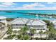 Stunning aerial view of waterfront property and marina with turquoise water and palm trees at 5856 Gasparilla Rd # Mv26, Boca Grande, FL 33921