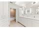 Bathroom has double sinks, skylight, and a separate tub/shower combo with a sliding glass door at 5856 Gasparilla Rd # Mv26, Boca Grande, FL 33921