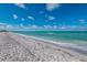 Beautiful beachfront with calm turquoise waters and soft sand, perfect for relaxation and recreation at 5856 Gasparilla Rd # Mv26, Boca Grande, FL 33921