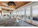 Sophisticated dining area with decorative lighting, ample seating, and expansive windows providing picturesque ocean vistas at 5856 Gasparilla Rd # Mv26, Boca Grande, FL 33921