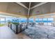 Elegant oceanfront dining room with vaulted ceilings, large windows offering stunning views, and stylish seating at 5856 Gasparilla Rd # Mv26, Boca Grande, FL 33921