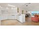 Modern kitchen featuring white cabinetry, sleek countertops, and an open layout to the living area at 5856 Gasparilla Rd # Mv26, Boca Grande, FL 33921