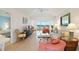 Comfortable living area with large windows and waterfront views that create a relaxing atmosphere at 5856 Gasparilla Rd # Mv26, Boca Grande, FL 33921