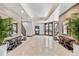 Inviting entryway with decorative tile flooring, stylish furnishings, and lush greenery, creating a welcoming atmosphere at 5856 Gasparilla Rd # Mv26, Boca Grande, FL 33921