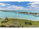 Beautiful waterfront view of boat docks, a bridge, and aqua water at 5856 Gasparilla Rd # Mv26, Boca Grande, FL 33921
