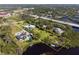 Large property with home, swimming pool, mature trees, and waterfront access at 60 N Oxford Dr, Englewood, FL 34223