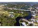 Sprawling waterfront property with lush greenery, a private dock, and easy access to the open water at 60 N Oxford Dr, Englewood, FL 34223