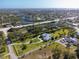 Beautiful waterfront property with a large lot, circular driveway, and stunning views of the surrounding area at 60 N Oxford Dr, Englewood, FL 34223