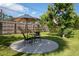 Back patio with umbrella table and chairs, perfect for outdoor dining at 60 N Oxford Dr, Englewood, FL 34223