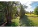 Well-maintained backyard featuring a mix of grass and shaded areas, perfect for outdoor enjoyment at 60 N Oxford Dr, Englewood, FL 34223