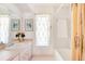 Bathroom featuring a shower-tub combo with a pink vanity and ample counter space at 60 N Oxford Dr, Englewood, FL 34223