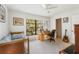 Bedroom with natural light, desk and guitar at 60 N Oxford Dr, Englewood, FL 34223