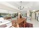Bright dining area with an open layout, a rustic wood table, and adjacent living spaces at 60 N Oxford Dr, Englewood, FL 34223
