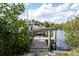 Private boat dock with a boat secured, offering direct waterfront access to the canal at 60 N Oxford Dr, Englewood, FL 34223