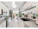 Well-lit kitchen boasts modern appliances, white cabinets, and ample counter space at 60 N Oxford Dr, Englewood, FL 34223