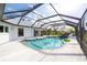 Stunning screened-in pool, perfect for relaxation and outdoor enjoyment at 60 N Oxford Dr, Englewood, FL 34223