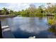 Scenic waterfront view of the canal with dock, providing relaxing water views at 60 N Oxford Dr, Englewood, FL 34223