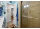 Bathroom with a glass shower and tile flooring at 7035 Duke St, Englewood, FL 34224