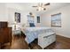 Bedroom with a bed, nautical decor, wood-look flooring and windows at 7035 Duke St, Englewood, FL 34224