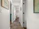 Hallway with neutral walls and tile flooring at 7035 Duke St, Englewood, FL 34224