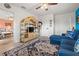 Comfortable living room showcasing tile floor, woven entertainment center, and access to additional living space at 7035 Duke St, Englewood, FL 34224