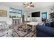 Open-concept living area featuring a seamless connection to the kitchen and comfortable seating arrangements at 7035 Duke St, Englewood, FL 34224