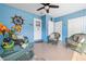 Bright sunroom featuring woven furniture, views of the backyard, and an inviting atmosphere at 7035 Duke St, Englewood, FL 34224