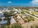 Aerial view of a coastal property marked with red lines, near the ocean and shops, perfect for seaside living at 7035 York St, Englewood, FL 34224