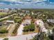 Charming single-story home with a well-defined perimeter, surrounded by lush greenery and a clear blue sky at 7035 York St, Englewood, FL 34224