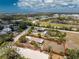 Defined coastal home with a spacious lot, perfect for enjoying water views and a serene neighborhood, outlined in red at 7035 York St, Englewood, FL 34224