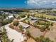Aerial view of a beautiful property, surrounded by lush greenery, close to the ocean and local amenities, outlined in red at 7035 York St, Englewood, FL 34224