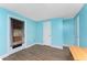 Bright bedroom features wood-look flooring, blue accent walls and has two doors at 7035 York St, Englewood, FL 34224
