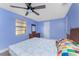 Well-lit bedroom with hardwood floors and a neutral color scheme offering a serene living space at 7035 York St, Englewood, FL 34224