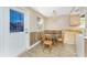 Bright breakfast nook features modern lighting and wainscotting at 7035 York St, Englewood, FL 34224