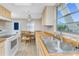 Bright kitchen featuring stainless steel sink, wooden counters, and modern appliances in a cozy space at 7035 York St, Englewood, FL 34224