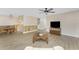 Inviting living area features wood-look floors and seamless transitions to dining at 7035 York St, Englewood, FL 34224