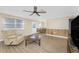 Open-concept living area with wood-look floors connecting to dining space at 7035 York St, Englewood, FL 34224