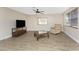 Cozy living room featuring wood-look flooring, neutral walls, and natural light at 7035 York St, Englewood, FL 34224
