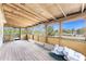 Enclosed patio featuring a wood floor and ceiling with walls of windows showing the outside at 7035 York St, Englewood, FL 34224